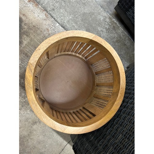 3015 - A round rattan and mango wood side table with storage *This lot is subject to VAT