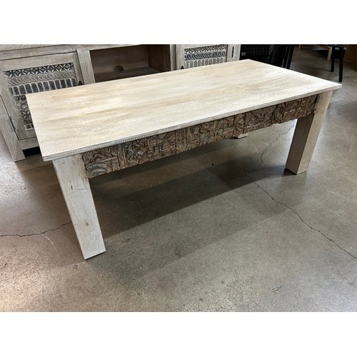 3025 - A wooden coffee table with a sandblast antique white finish