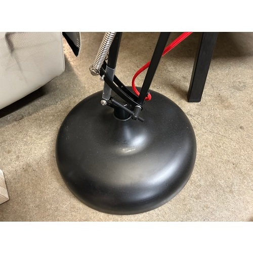 3077 - A black floor standing angled poise lamp