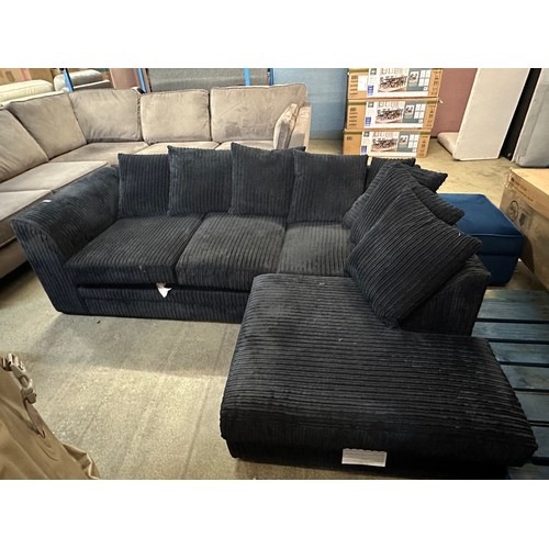 3233 - A black jumbo cord upholstered compact corner sofa - (transit marked)