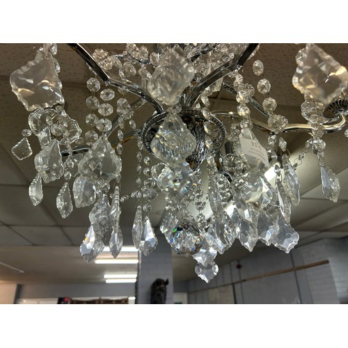 3176 - A six arm chandelier