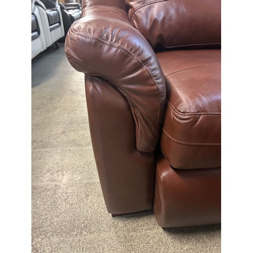 3217 - A brown leather corner sofa with ottoman