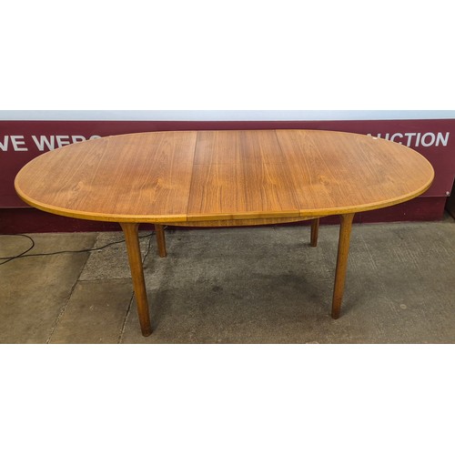 3 - A McIntosh teak oval extending dining table