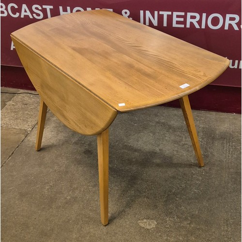 7 - A Ercol Blonde elm and beech Windsor drop leaf table