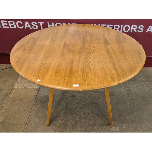 7 - A Ercol Blonde elm and beech Windsor drop leaf table