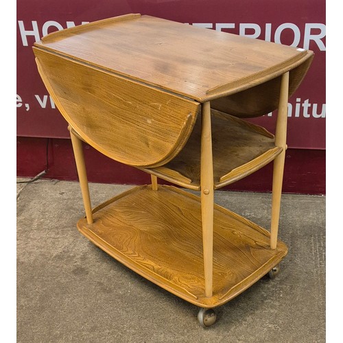 6 - An Ercol Blonde elm Windsor trolley