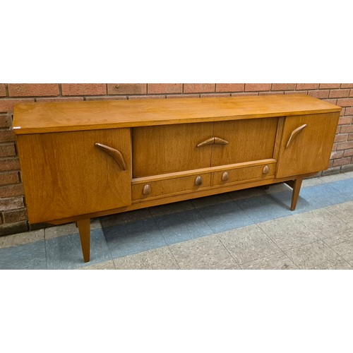 21 - A teak sideboard