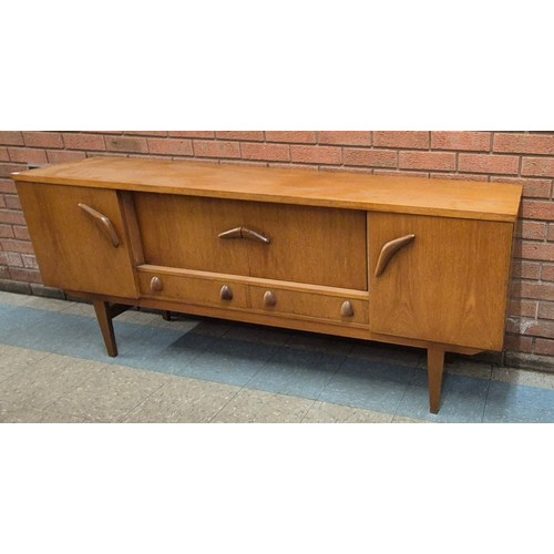 21 - A teak sideboard