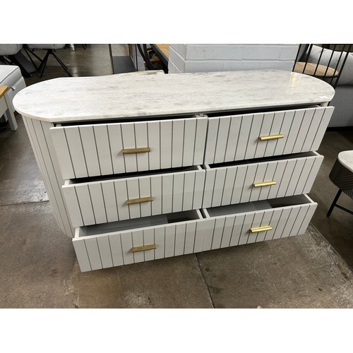 3024 - A mango wood and marble chest * This lot is subject to Vat