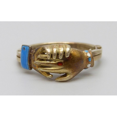 7005 - A 9ct gold and enamel clasped hands ring, opens to reveal an enamel heart, 3.6g, L/M