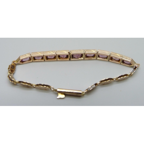 7012 - A 9ct gold and amethyst set bracelet, 10.9g, 17cm