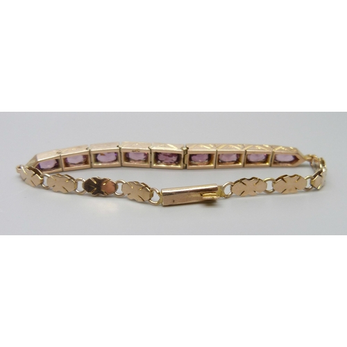 7012 - A 9ct gold and amethyst set bracelet, 10.9g, 17cm