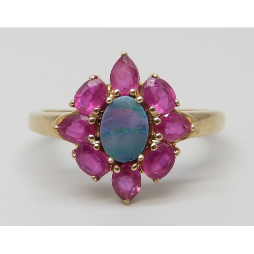 7016 - A 9ct gold, doublet opal and red stone ring, 2.6g, S