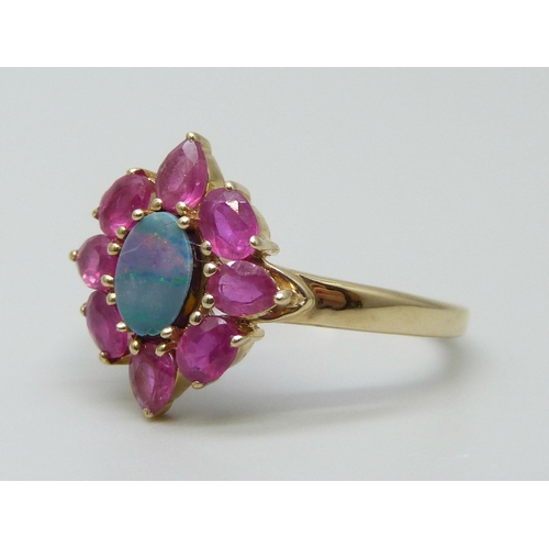 7016 - A 9ct gold, doublet opal and red stone ring, 2.6g, S