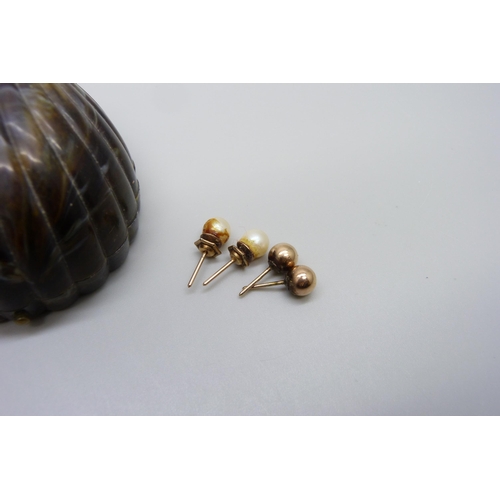 7018 - Two pairs of 9ct gold stud earrings, one set with pearls, 2.4g