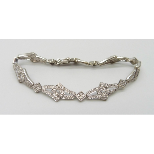 7024 - A 9ct gold diamond bracelet, 11.5g, 17.5cm