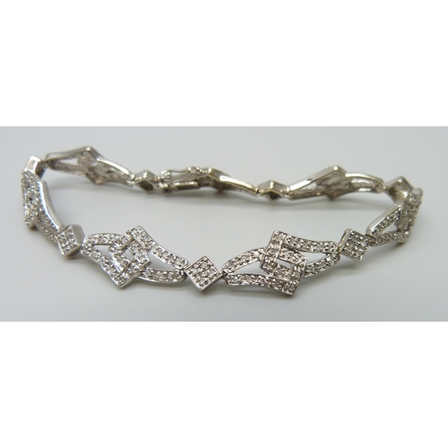 7024 - A 9ct gold diamond bracelet, 11.5g, 17.5cm