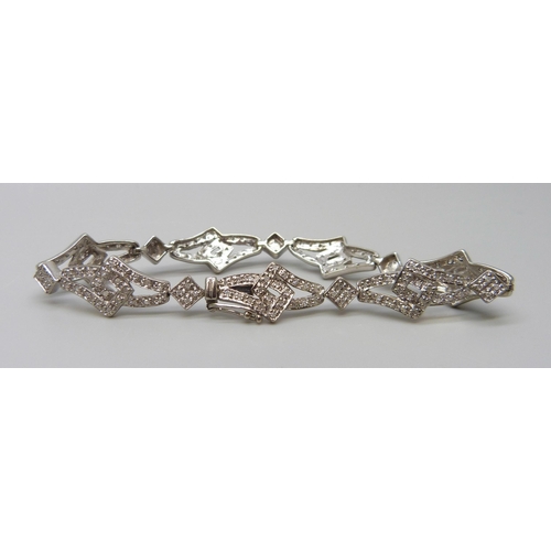 7024 - A 9ct gold diamond bracelet, 11.5g, 17.5cm