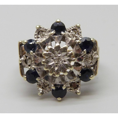 7032 - A 9ct gold, diamond and sapphire cluster ring, 5.9g, P