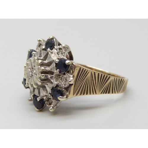 7032 - A 9ct gold, diamond and sapphire cluster ring, 5.9g, P