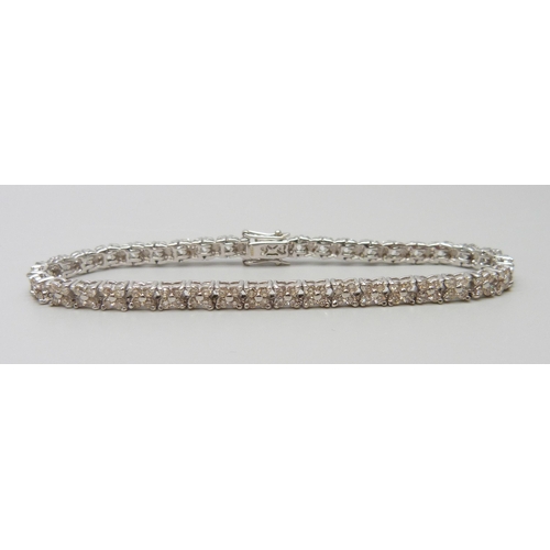 7035 - An 18ct white gold and diamond set tennis bracelet, lacking one diamond, 13.7g, 17cm