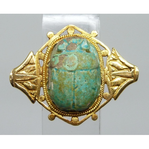 7036 - A yellow metal scarab beetle brooch, high carat, a/f, pin requires repair, 8.1g, 32mm wide