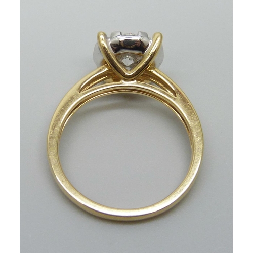 7037 - An 18ct gold and diamond ring, set with nine diamonds, the shank marked 1.00, 5.3g, P, ring top 10mm... 