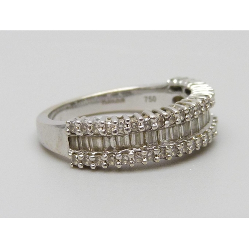 7038 - An 18ct white gold and diamond ring set with baguette and round cut diamonds, 4.4g, L