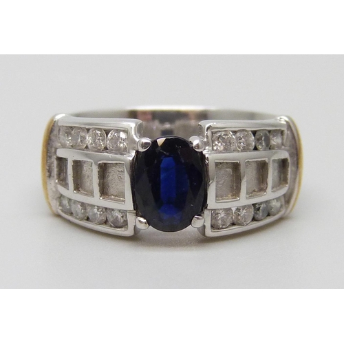 7047 - A 9ct white gold ring set with a sapphire and diamonds, 5.8g, N