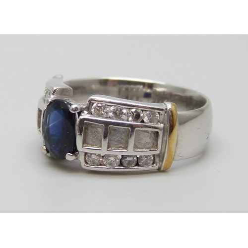 7047 - A 9ct white gold ring set with a sapphire and diamonds, 5.8g, N