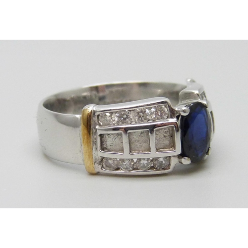 7047 - A 9ct white gold ring set with a sapphire and diamonds, 5.8g, N