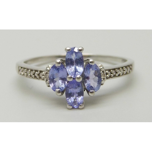 7054 - A 10k white gold and tanzanite ring, 2.4g, U