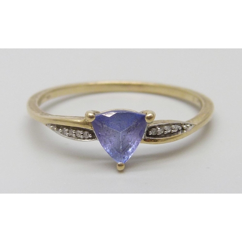 7057 - A 10k gold and tanzanite ring with diamond accents, 1.6g, U