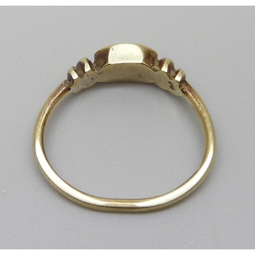 7064 - A 9ct gold ring, closed back setting, 2g, J, (shank out of shape)