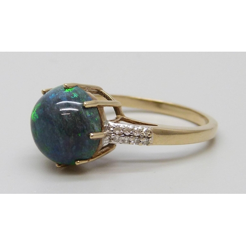 7065 - A 9ct gold, black opal and diamond ring, 3.1g, P, diameter of opal 9mm