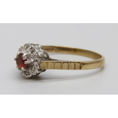 7068 - A 9ct gold, red stone and diamond ring, 2g, P