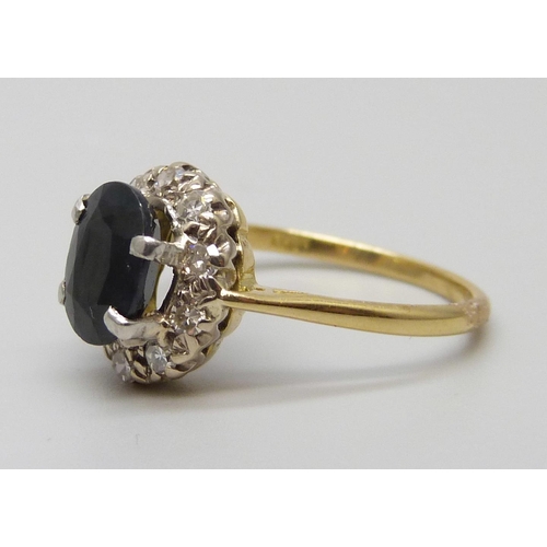 7070 - An 18ct gold, diamond and sapphire ring, 2.9g, M/N