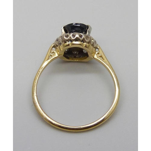 7070 - An 18ct gold, diamond and sapphire ring, 2.9g, M/N