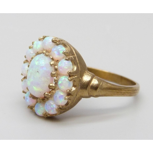 7073 - A 9ct gold opal cluster ring, 3.2g, O