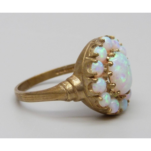 7073 - A 9ct gold opal cluster ring, 3.2g, O