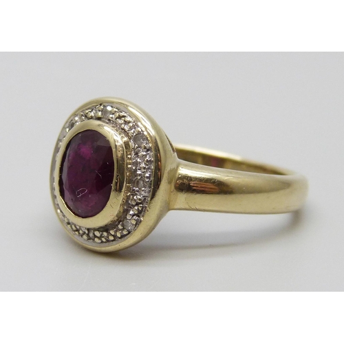 7083 - A 9ct gold ruby and diamond cluster ring, 3.9g, N, with certificate