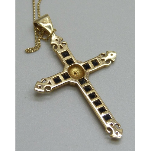 7088 - A 9ct gold cross pendant set with sapphires and diamonds, 3.5cm, on a 9ct gold chain, 1.7g