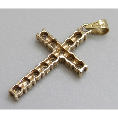 7090 - A 9ct gold and diamond cross pendant, 2g, 3cm