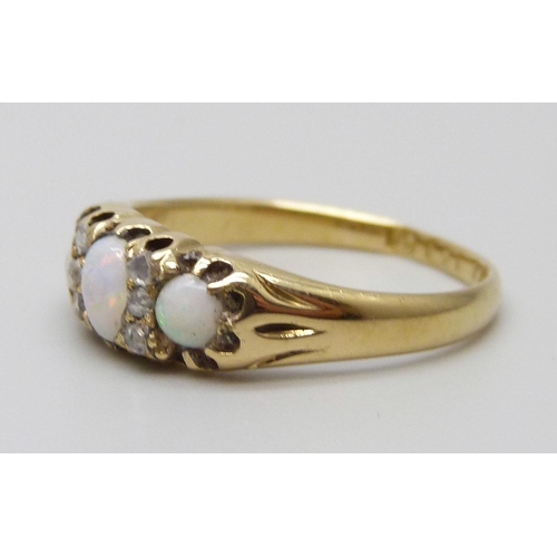 7097 - An 18ct gold, opal and diamond ring, Sheffield 1886, 3.6g, N