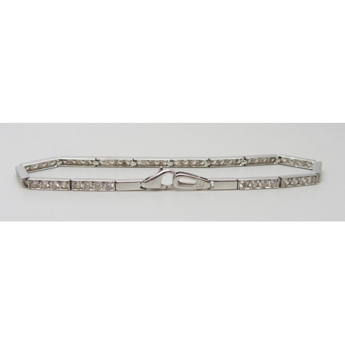 7104 - A 14ct white gold tennis bracelet set with white stones, stamped 585, 7.1g, 19cm