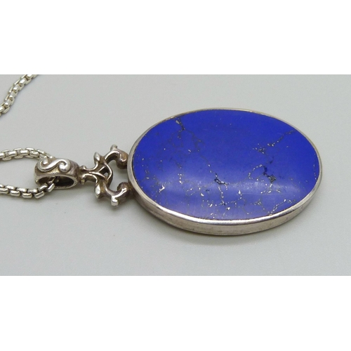 7108 - A silver pendant set with lapis lazuli, on a silver chain, 26g, pendant 5cm