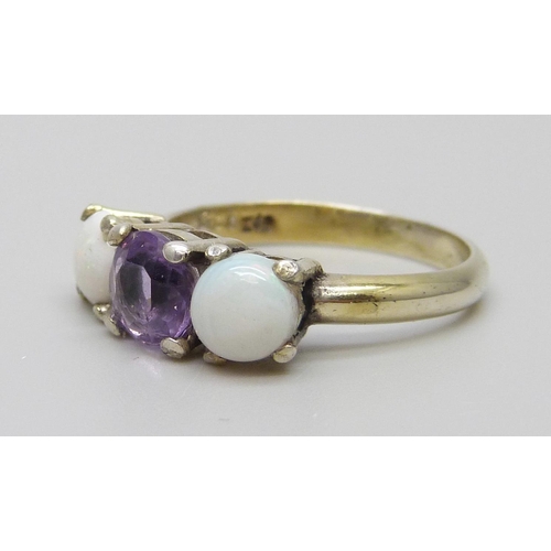 7113 - A silver gilt opal and amethyst three stone ring, N