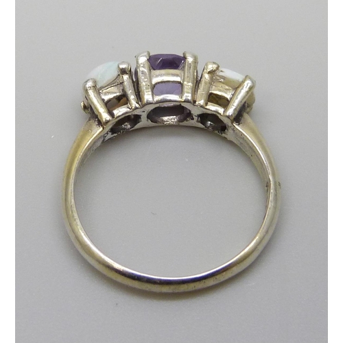 7113 - A silver gilt opal and amethyst three stone ring, N