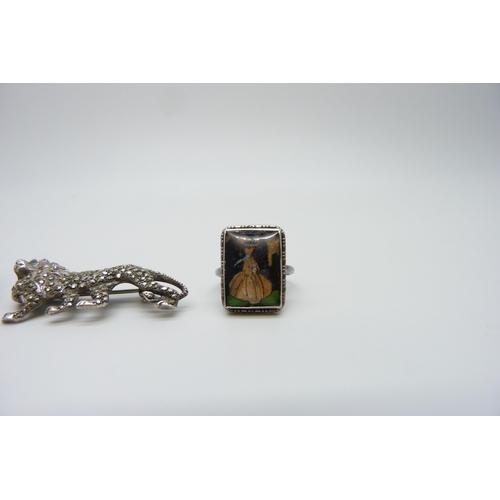 7115 - A silver butterfly wing ring and two silver brooches including one in the form of a lion