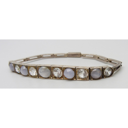 7119 - A white metal, moonstone and white spinel set bracelet, 11.5g, 16.5cm